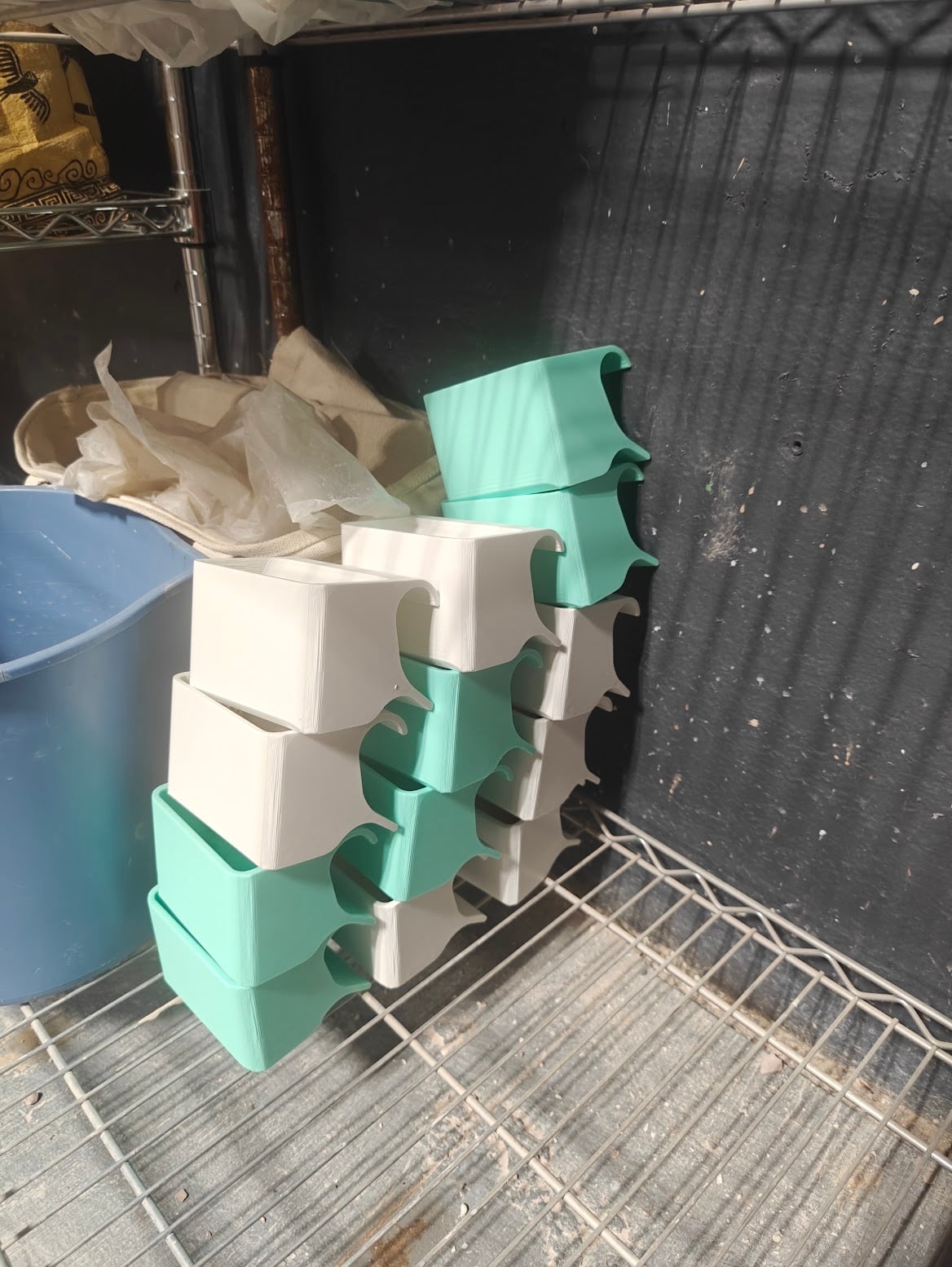 Stacked mint and white tool caddies