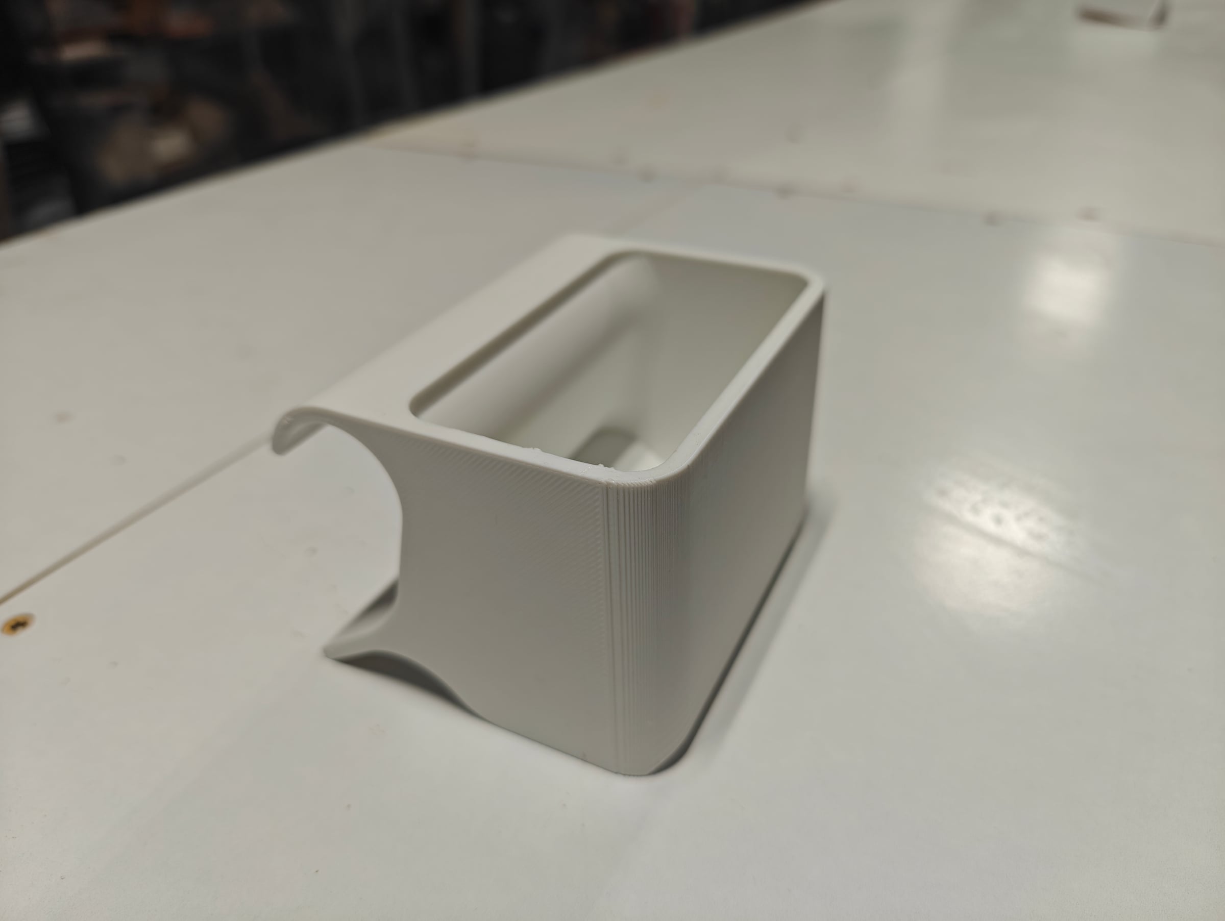 White 3D-printed pottery tool caddy on a studio table